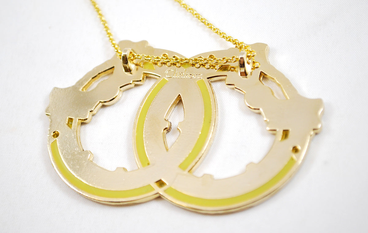 Mio's Moonblades as a Necklace Keychain or Pin Metal and Enamel