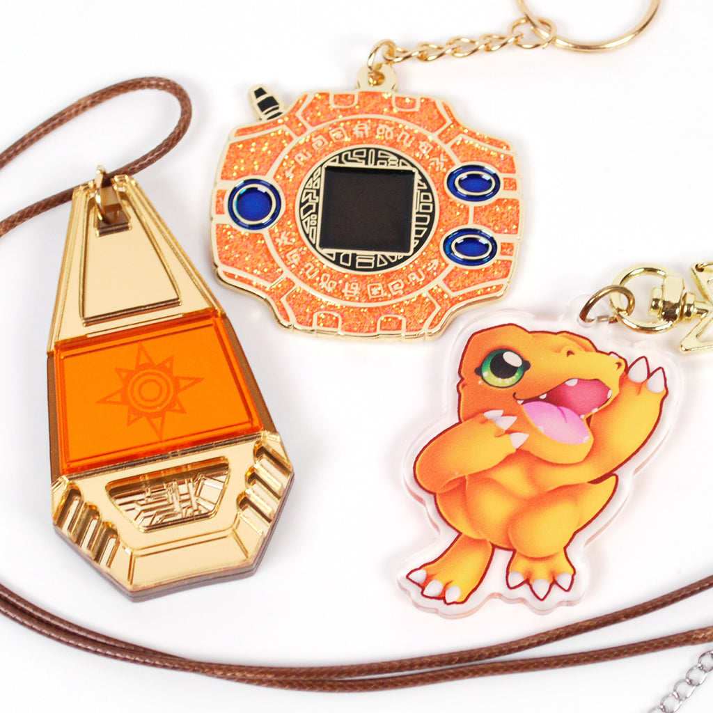 Three charms on a white background.