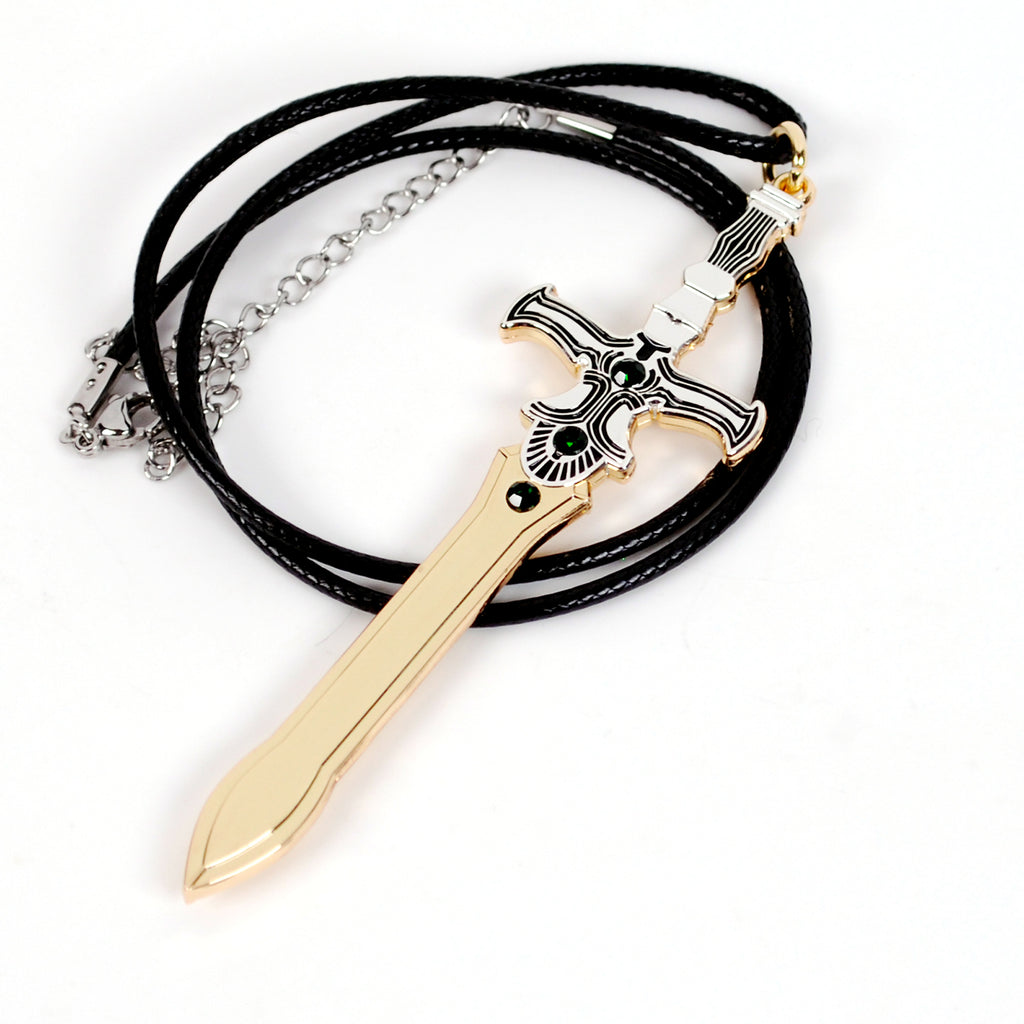 A replica of Ike's Ragnell from Fire Emblem, featuring a polished gold-colored blade and hilt with silver and black detailing, suspended from a multi-strand black cord necklace on a white background.