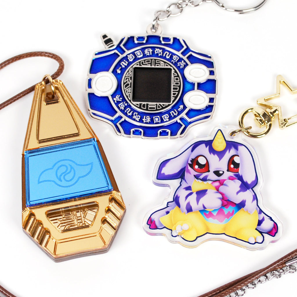 Three keychains with different designs on a white background