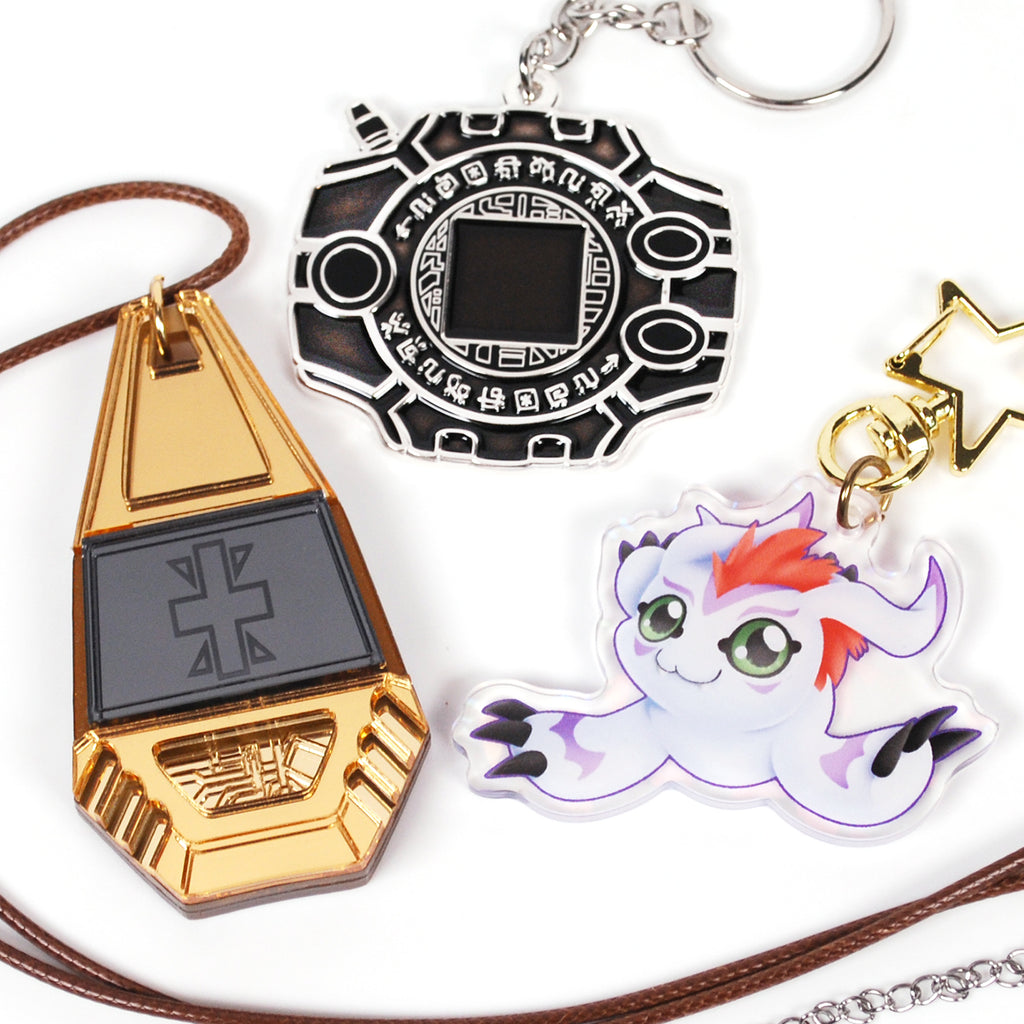 Three colorful keychains on a white background.