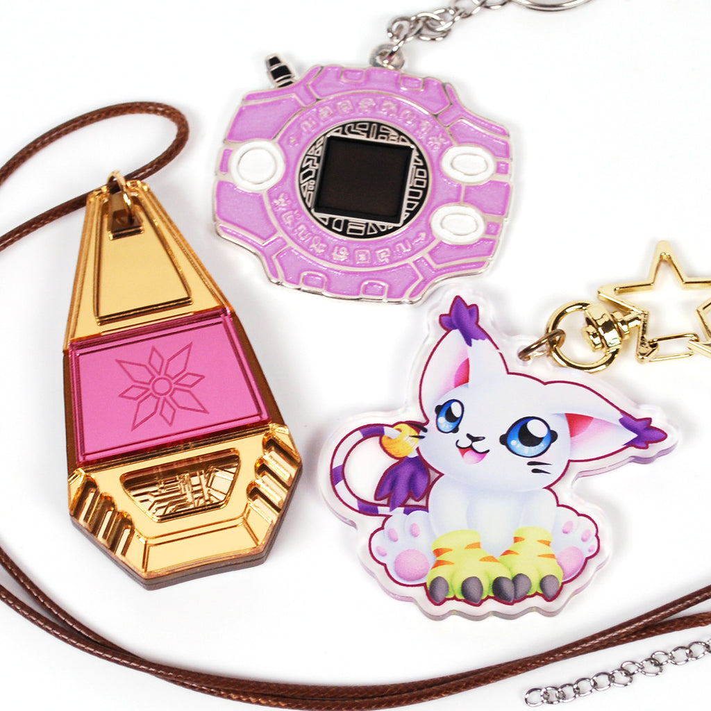 Collection of colorful keychains and charms on a white background