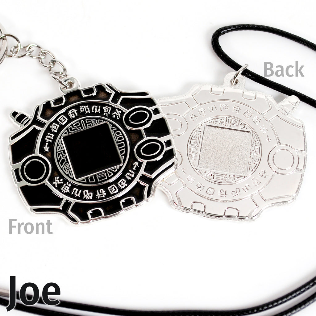 Front and back of Joe digivice, showing black colors on silver metal with a keychain or necklace attachment.