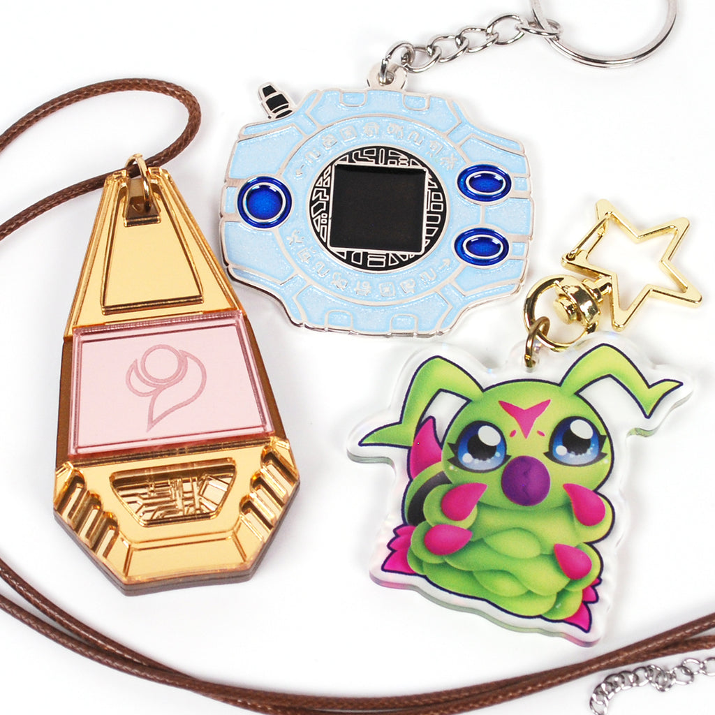 Collection of colorful keychains and charms on a white background