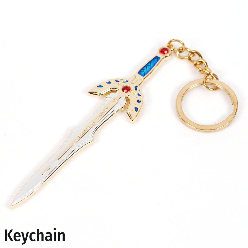 A fantasy sword-shaped keychain with a gold-tone blade and hilt, blue inlay details, and small red gem accents, attached to a gold key ring on a white background.