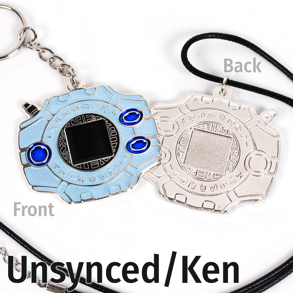 Front and back of synced/Ken digivice, showing light blue and dark blue colors on silver metal with a keychain or necklace attachment.