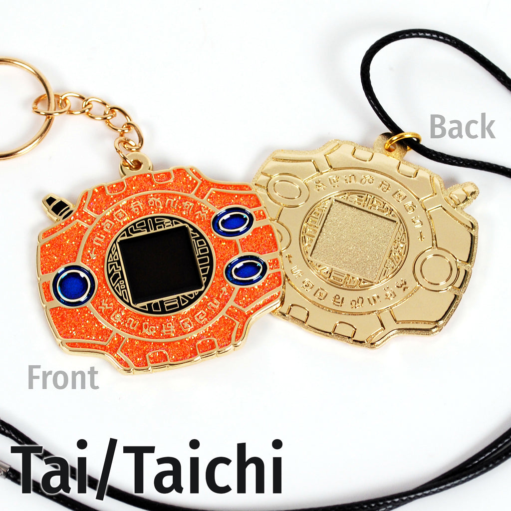 Front and back of Tai digivice, showing orange and blue colors on gold metal with a keychain or necklace attachment.