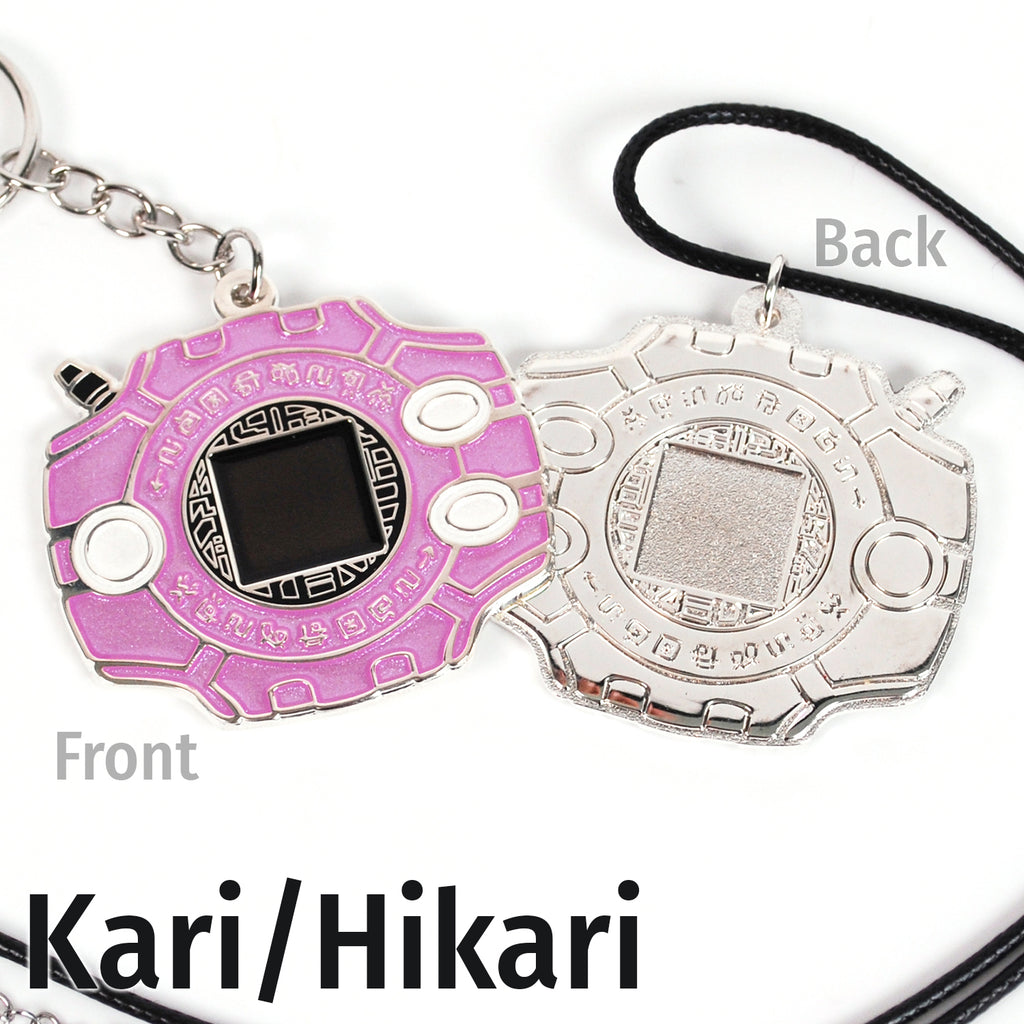 Front and back of Kari digivice, showing pink and white colors on silver metal with a keychain or necklace attachment.